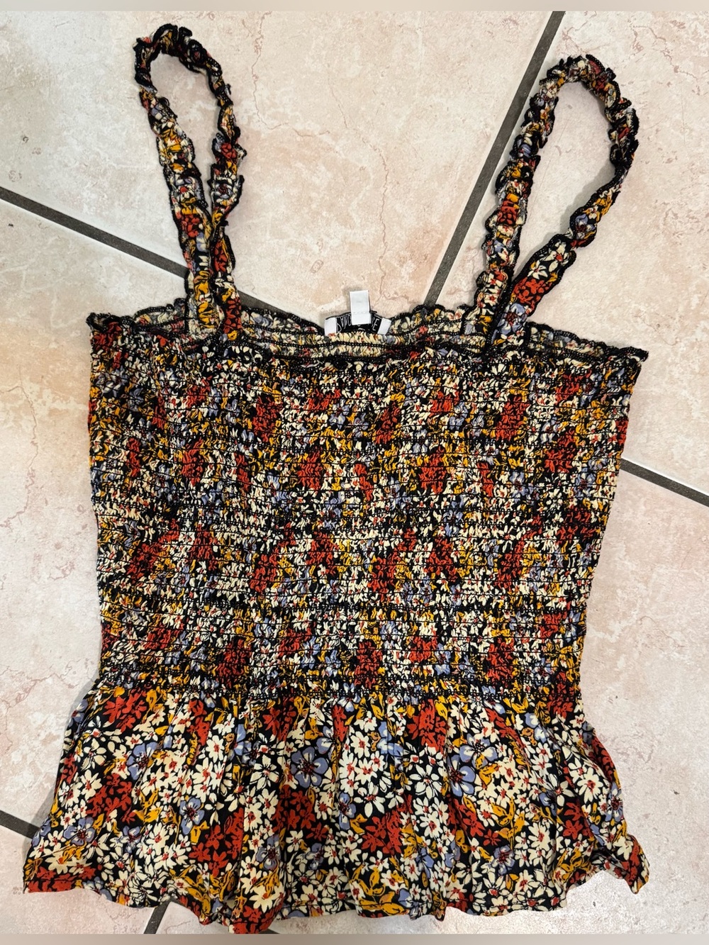 Multi-colored floral tank top with ruffled straps and elastic back